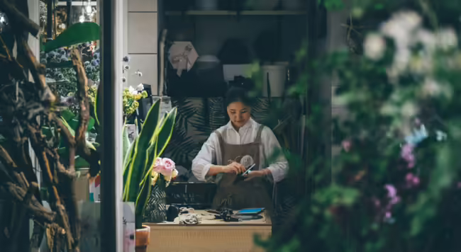 female owner working in floral shop