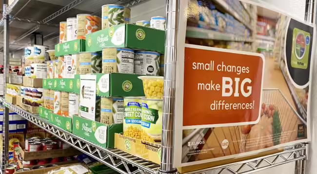 Picture of canned food on shelf of food pantry