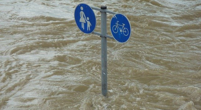 high water with pedestrian sign show flooded