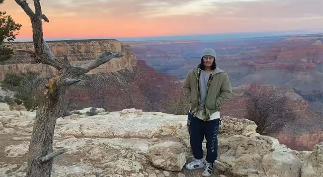 2023 DOIT Scholar Yu Tian standing at the Grand Canyon