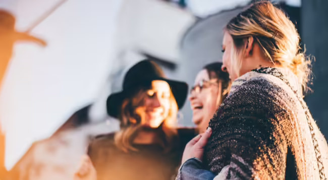 three women laughing and having good time