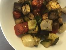 Closeup of roasted vegetables on white plate
