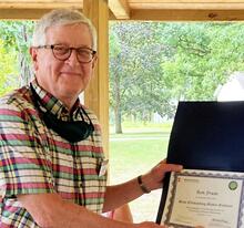 Ron Fruin with a certificate