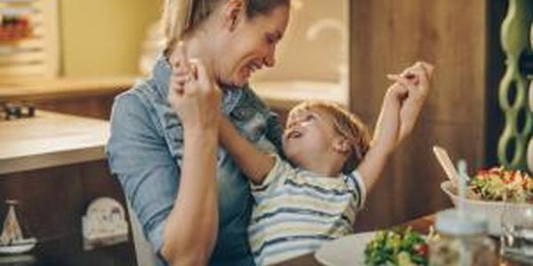 Mother and son at dinner table