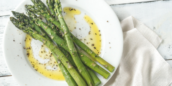 Asparagus on a plate in butter
