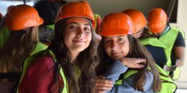 two girls in hard hats