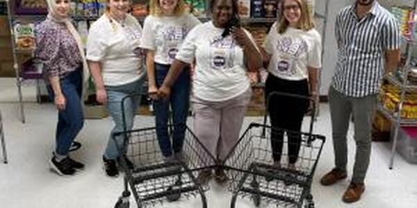 people at food pantry with shopping carts