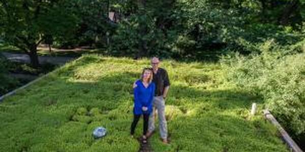 couple on their green roof structure