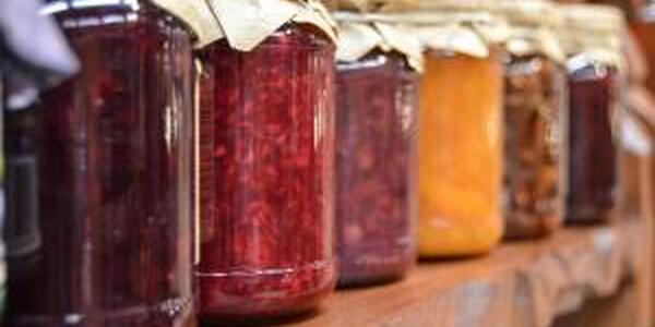 A display of jars with food in them. 