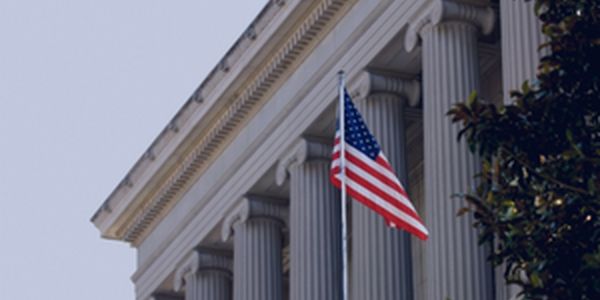 american flag in front of government building