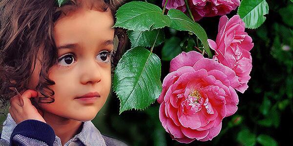 young girl in rose garden