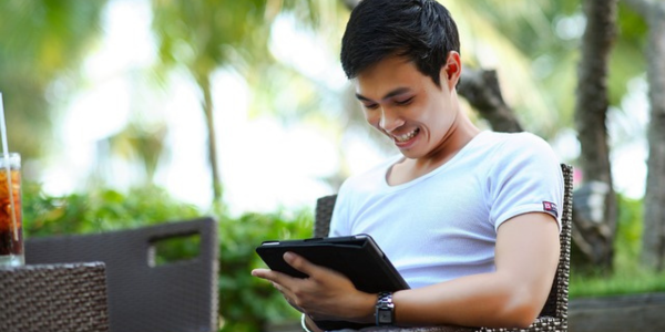 Man reading news on computer