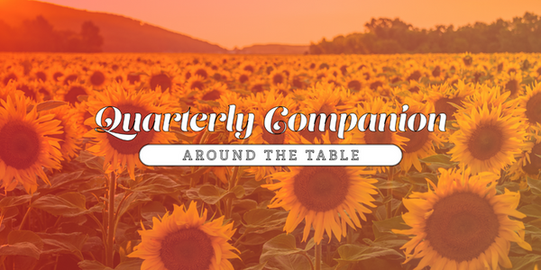 "Quarterly Companion: Around the Table" in a field of sunflowers