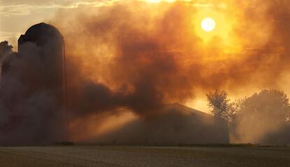 Far view of the scene of a farm fire.