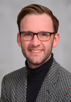 headshot of Kevin Carey